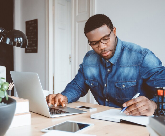 Young man working at home.