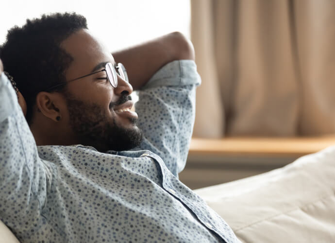 Smiling man sitting on a couch